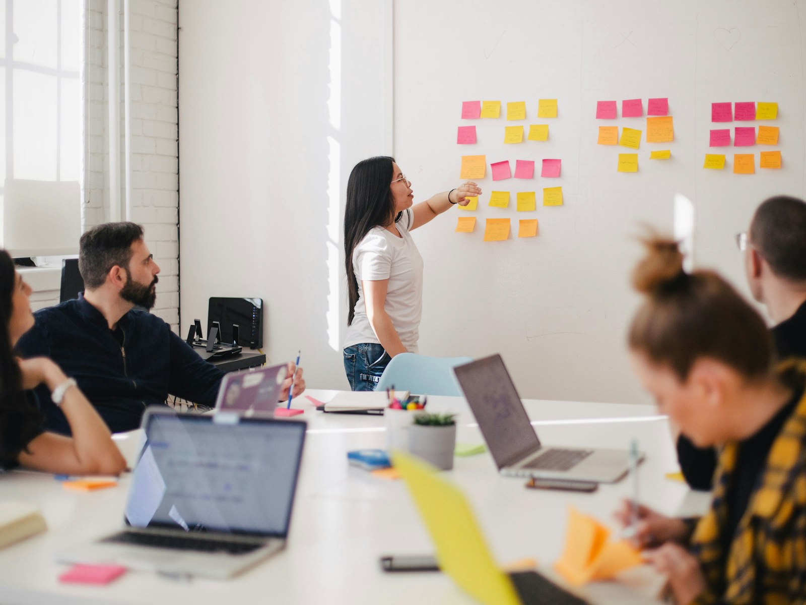 Workshop with sticky notes and laptops